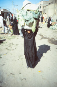 Village Lady With Huge Basket Of Cabbages Balanced On Her Head